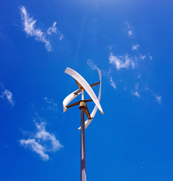 istock Wind turbine with unusual blades against a blue summer sky with light cloud 1458178795