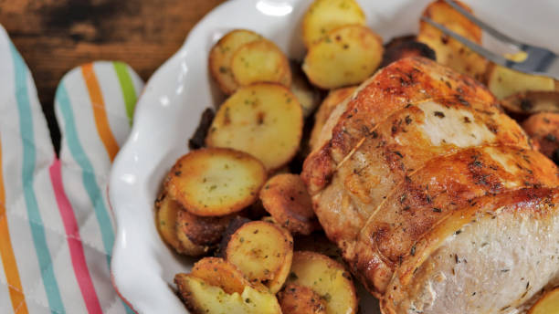 istock roast pork and sarladaise potatoes in a dish 1458186760