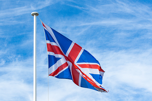 United Kingdom flag, close-up, under a blue sky