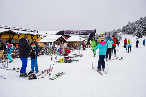 Bormio, Italy - February 15, 2022. Tourists relaxing in nature. Winter sport in Bormio ski resort in Sondrio, Lombardy region in Italy.