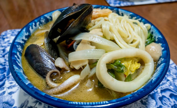 istock Asian style seafood noodle soup in a serving bowl 1458187248