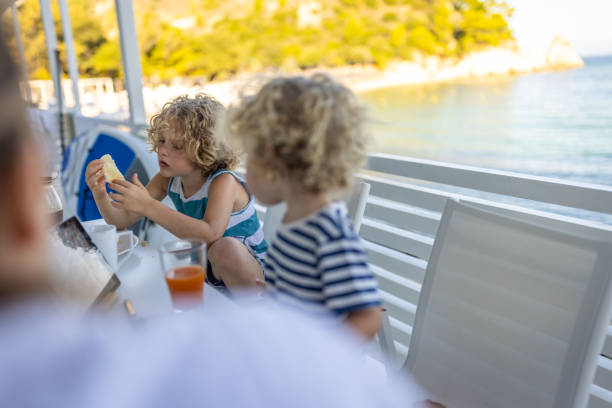 istock Boys enjoys breakfast on summer vacation 1458193885