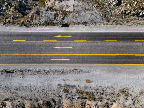 istock Asphalt road in mountains shoot directly above 1458193934