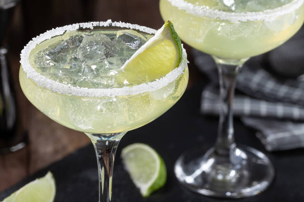 istock Margarita cocktail with ice, lime and salt rimm 1458194548