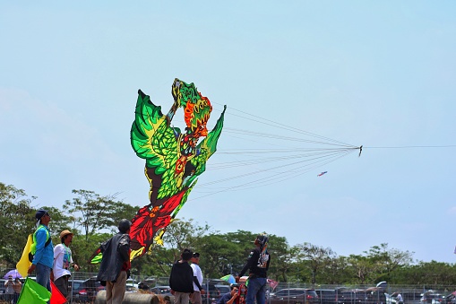 Surabaya, Indonesia - September 26, 2022 : the team is preparing kites at the surabaya kite festival