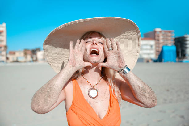 Happy woman holding Hands on open mouth,