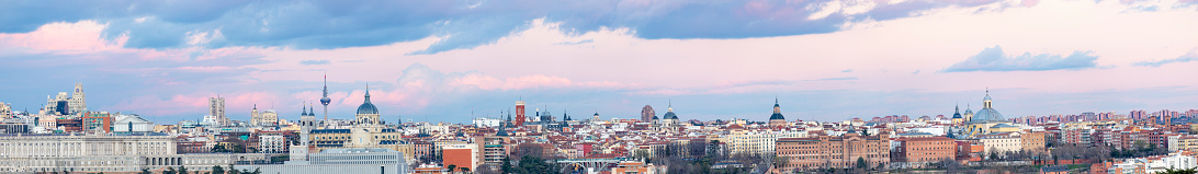 Panoramic views of the Skyline of the city of Madrid during sunset with cloudy day