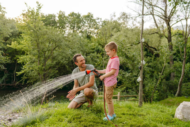 istock Watering the lawn together 1458204693