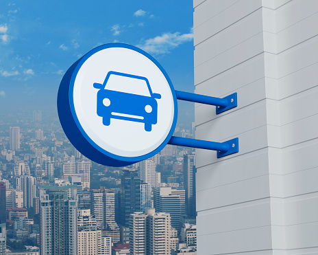 Car icon on hanging blue rounded signboard over modern city tower, office building and skyscraper, Business transportation service concept, 3D rendering