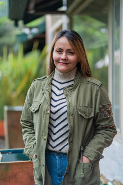 istock Therapist looking at the camera in a portrait while outside her home 1458206355