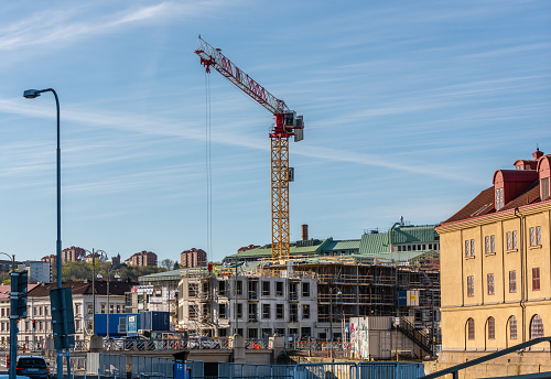 Gothenburg, Sweden - May 03 2022: Construction crane by a construction site.