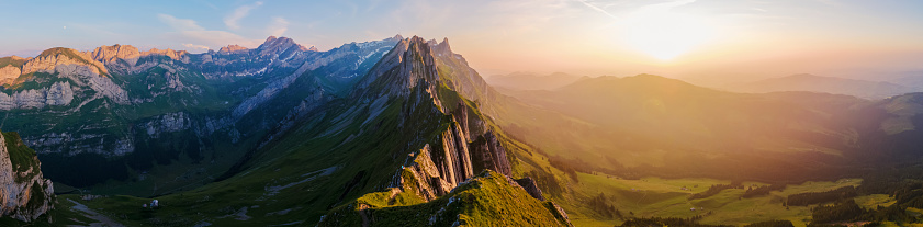 Schaeffler mountain ridge swiss Alpstein, Appenzell Switzerland, a steep ridge of the majestic Schaeffler peak, Switzerland. couple man and woman mid age in the mountains, man and woman hiking