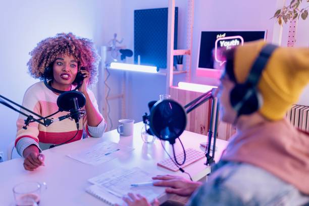 istock Two radio show hosts record podcast episode in home studio 1458213434