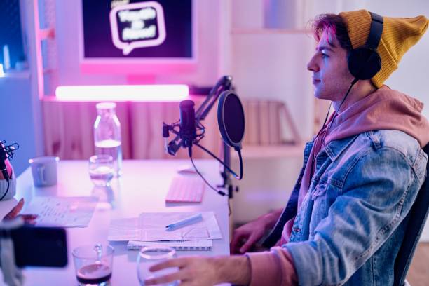 istock Two people record podcast episode in home studio 1458213442