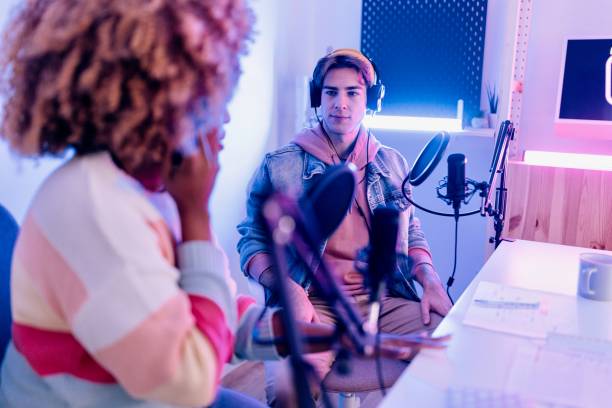 istock Two radio show hosts record podcast episode in home studio 1458214041