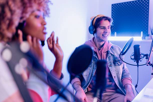 istock Two radio show hosts record podcast episode in home studio 1458214084