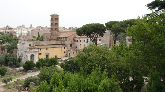 Rome, Italy, June 23 2021. A glimpse of one of the ancient churches seen from the park during a summer day.