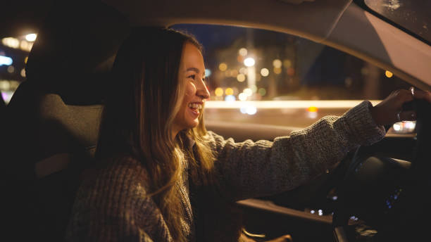 istock Happy young woman driving home after work 1458215558