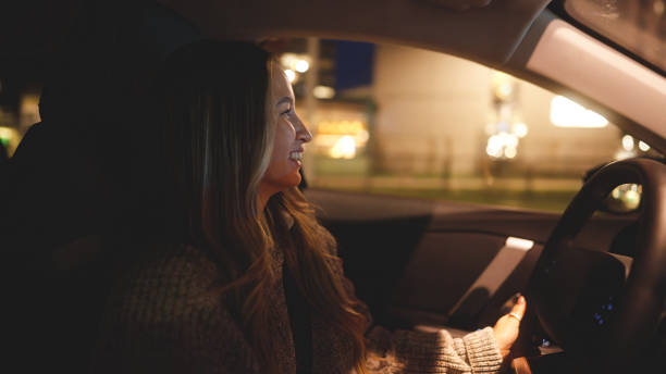 istock Happy young woman driving home after work 1458215559