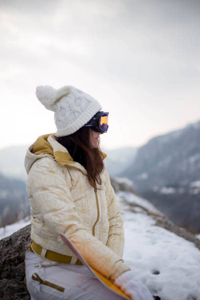 istock Smiling female snowboarder 1458216137