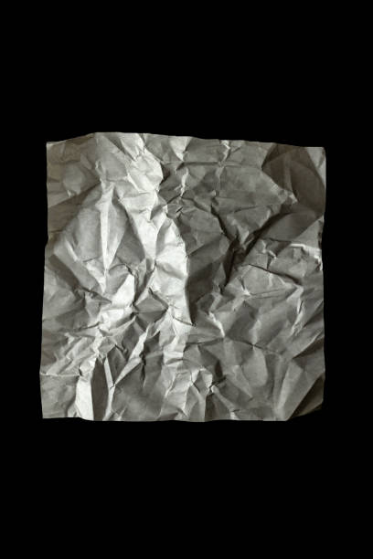 Gray color crumpled paper on black background. Texture, Background