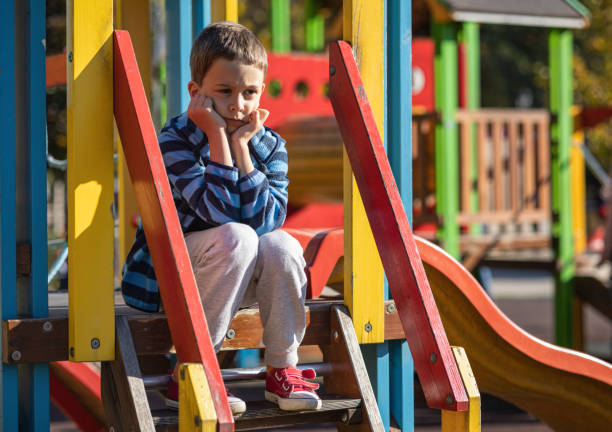 Kid holding head and missing his friends