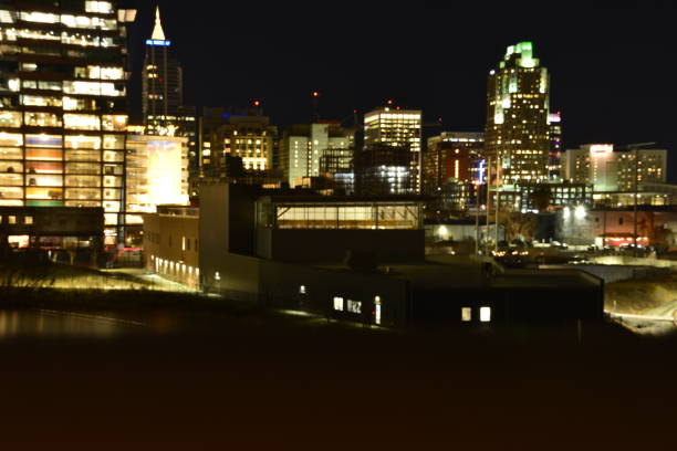 istock Defocused Raleigh City Skyline At Night 1458220192