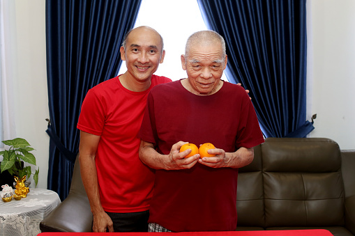 Portrait of an Asian family - father and son.