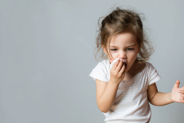 istock Little Girl Cleaning Her Nose 1458225636
