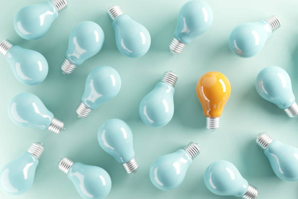 istock Minimal idea of yellow light bulb surrounded with blue bulbs on pastel background. 3d rendering. Idea creative Concept. Copy space. 1458227330