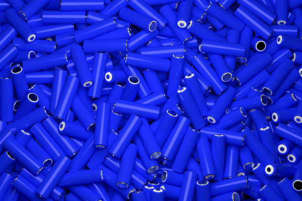 Top view full frame background of many 18650 lithium blue batteries chaotically arranged. stock photo