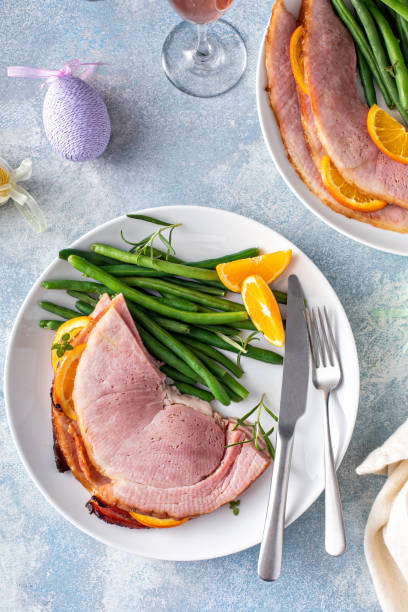 istock Easter ham served on a plate with green beans 1458229372