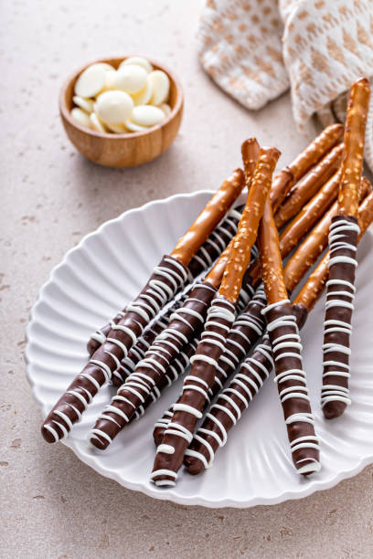 istock Chocolate covered pretzel rods homemade on a white plate 1458229621