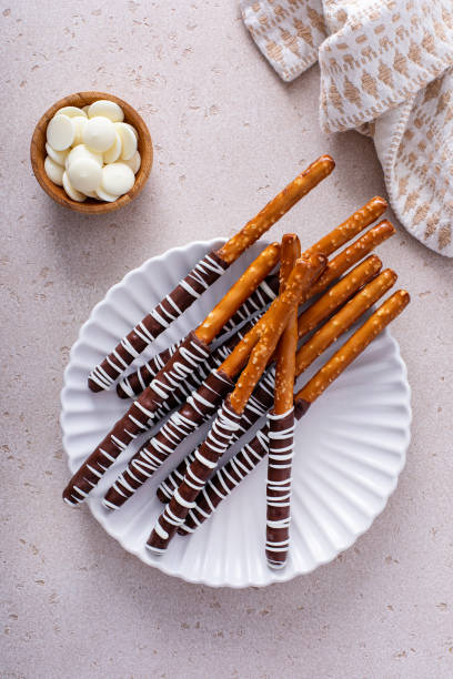 istock Chocolate covered pretzel rods homemade on a white plate 1458229639
