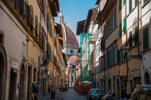 A street leading to the Cathedral of Santa Maria Del Fiore on a sunny day in the summer in the City of Florence