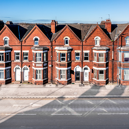 High angle view of three storey, Victorian terraced houses on a street in Doncaster in the North of England