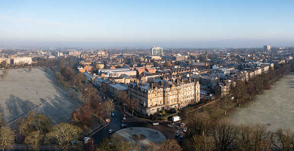 Aerial landscape view of the Yorkshire Spa town of harrogate with Victorian buildings and The Stray public park on a cold Winter day