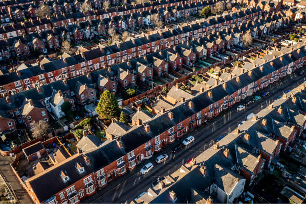 Aerial view of the rooftops of back to back terraced houses in the North of England An aerial view of rows of back to back terraced houses in a working class area of a Northern town in England row house stock pictures, royalty-free photos & images
