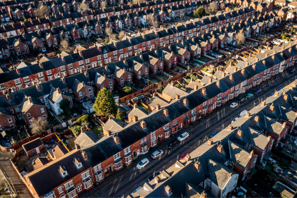 Aerial view of the rooftops of back to back terraced houses in the North of England An aerial view of rows of back to back terraced houses in a working class area of a Northern town in England run down neighborhood stock pictures, royalty-free photos & images