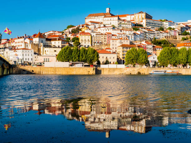 stunning skyline of coimbra reflected in mondego river, portugal - porto portugal bridge international landmark imagens e fotografias de stock