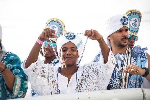 Salvador, Bahia, Brazil - February 11, 2018: Musicians from the traditional carnival group Filhos de Gandy, parade through the streets of Salvador, Bahia, during Carnival.