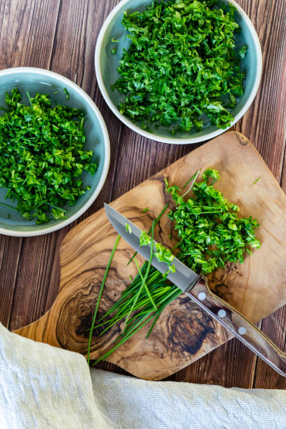 https://media.istockphoto.com/id/1458239241/photo/fresh-and-chopped-spicy-parsley-and-chives-herbs-on-cutting-board-top-view.jpg?s=612x612&w=0&k=20&c=ryCQtVxMiqmdCMcizmNok541wLZ7urnSo9HwBtTrHtM=