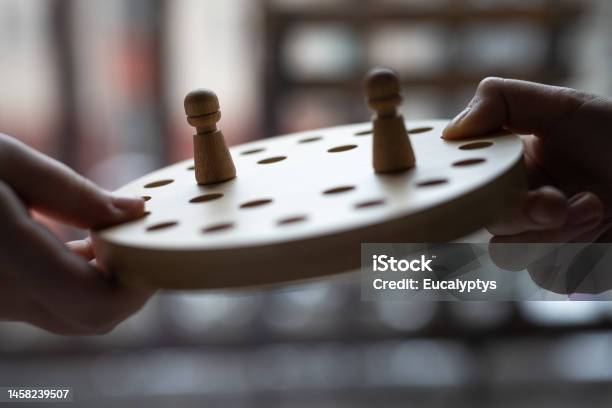 Wooden Memory Game In Child Hands Stock Photo - Download Image Now - 12-13 Years, Balance, Boys