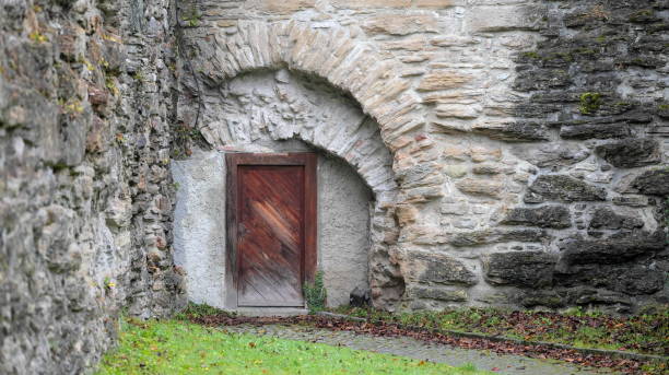 istock Wooden gate in old walls 1458242479
