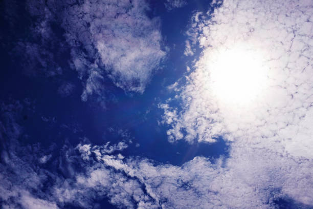 Bright sun lights up the clouds overhead.