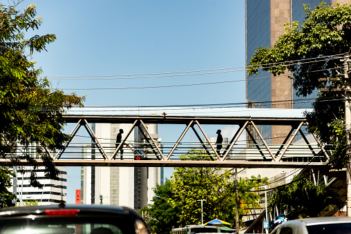 Salvador, Bahia, Brazil - May 06, 2022: Pedestrians are crossing a footbridge in the city center of Salvador, Brazil.