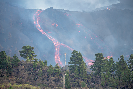 Lava tongues coming down the mountain on the island of La Palma in the Canary Islands during the eruption of the volcano on spring season