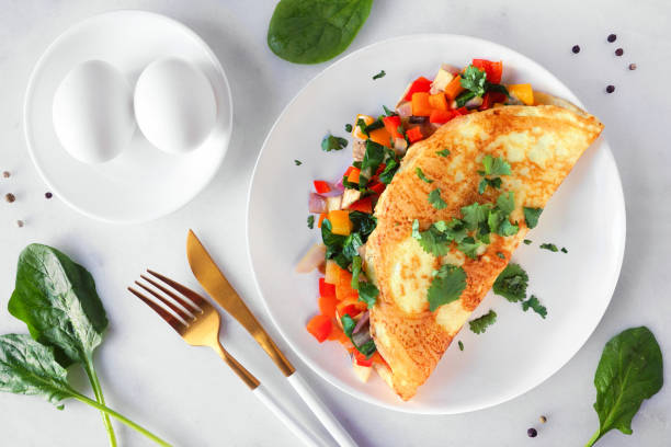 istock Healthy vegetable omelette, above view table scene over white marble 1458259840