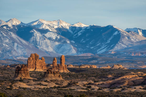 istock Rock formations with distant snow-covered mountains in the distance 1458261507