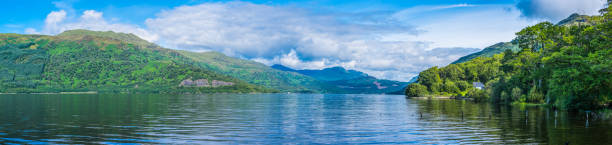 Idllyic lake shore mountains Loch Lomond Trossachs Highlands Scotland panorama stock photo